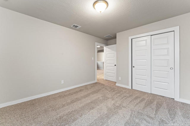 15011 Wychwood, San Antonio, TX 78233 - unfurnished bedroom featuring carpet floors, baseboards, visible vents, and a closet