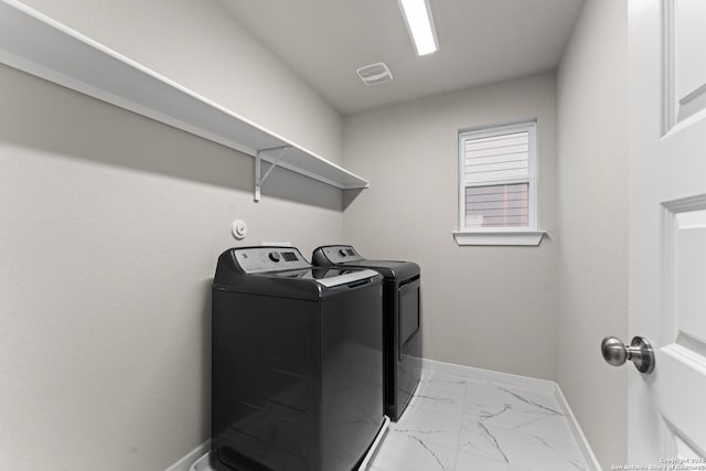 15011 Wychwood, San Antonio, TX 78233 - laundry room with laundry area, visible vents, washing machine and dryer, baseboards, and marble finish floor