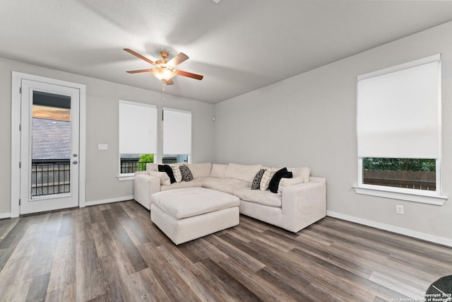 15011 Wychwood, San Antonio, TX 78233 - living room featuring ceiling fan, dark wood-style floors, and baseboards