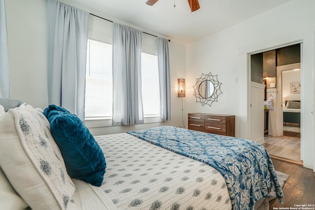 bedroom with wood-type flooring and ceiling fan