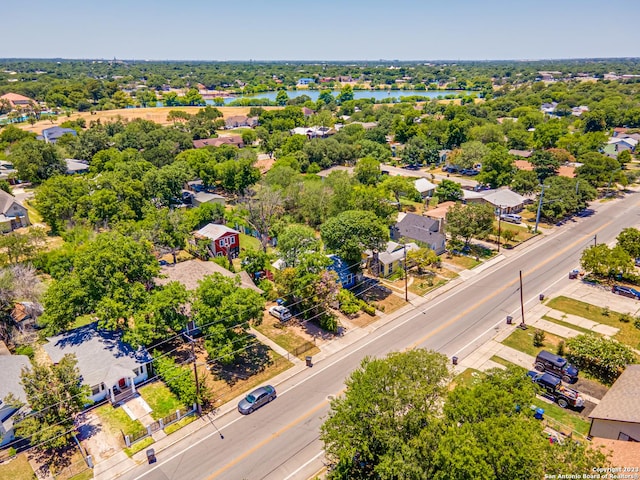 birds eye view of property with a water view and a residential view