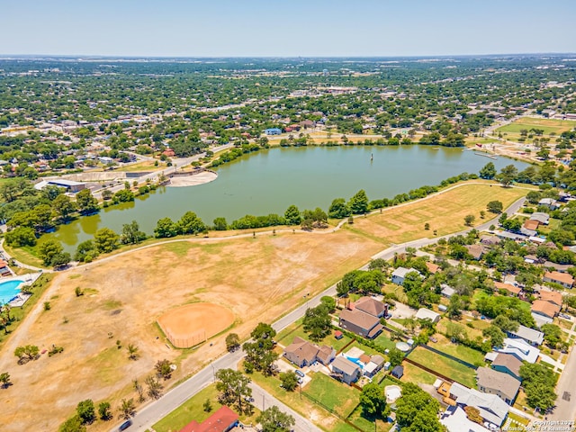 drone / aerial view featuring a residential view and a water view