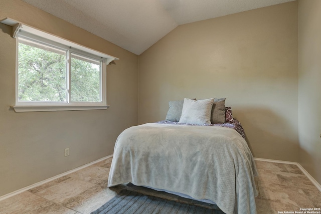 8811 Silent Strm, San Antonio, TX 78250 - bedroom with baseboards and vaulted ceiling