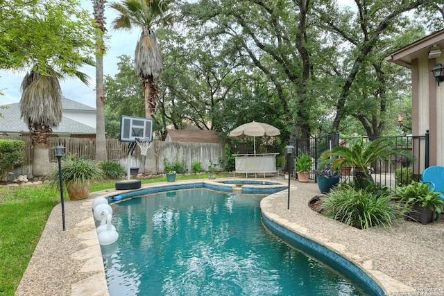 8811 Silent Strm, San Antonio, TX 78250 - view of pool featuring a fenced backyard and a pool with connected hot tub