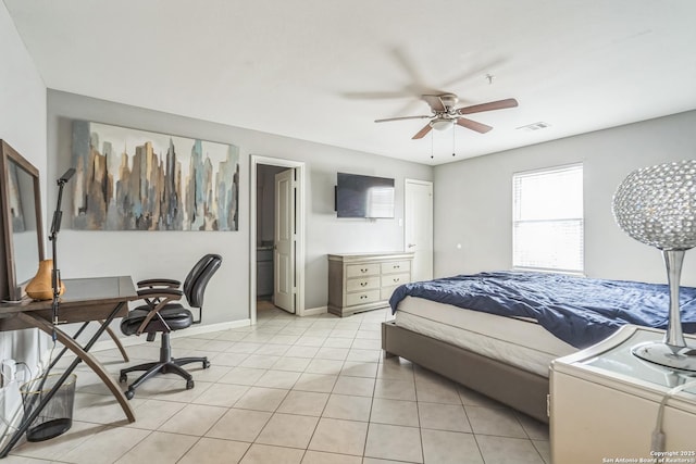 bedroom featuring visible vents, baseboards, ceiling fan, and light tile patterned floors