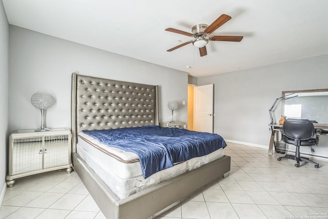 bedroom featuring baseboards, a ceiling fan, and light tile patterned flooring