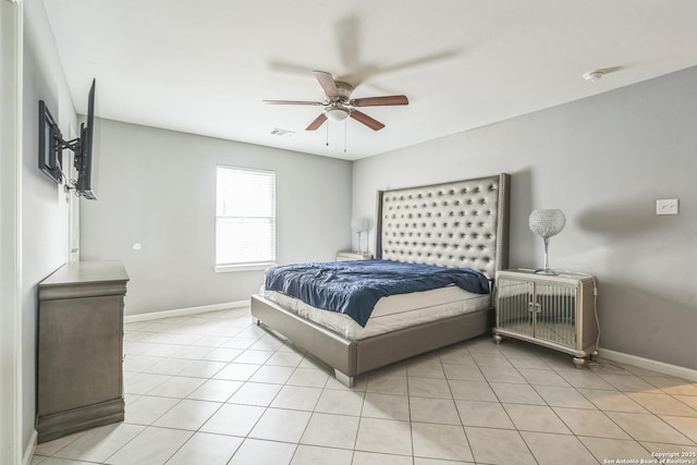 bedroom featuring visible vents, baseboards, ceiling fan, and light tile patterned floors