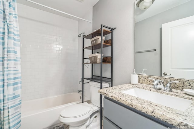 full bathroom featuring vanity, shower / bath combo, and toilet