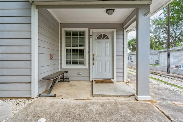 property entrance with fence