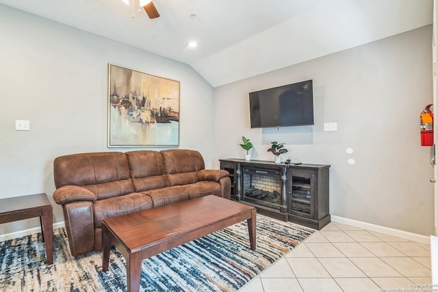 living room with a ceiling fan, baseboards, recessed lighting, light tile patterned floors, and vaulted ceiling