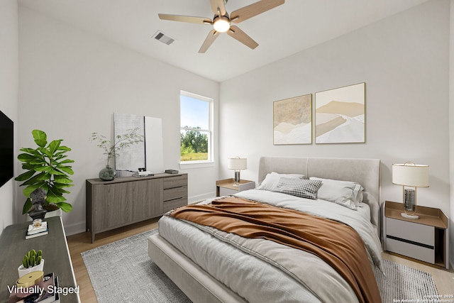 25 Main, Hempstead, TX 77445 - bedroom with baseboards, a ceiling fan, wood finished floors, and visible vents