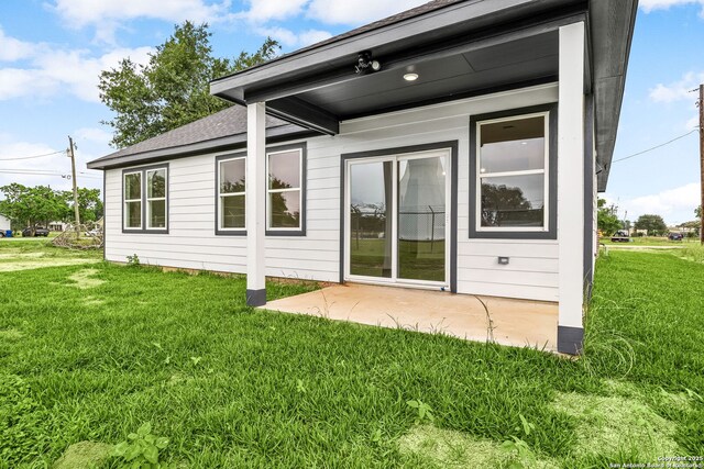 25 Main, Hempstead, TX 77445 - rear view of property with a patio and a yard