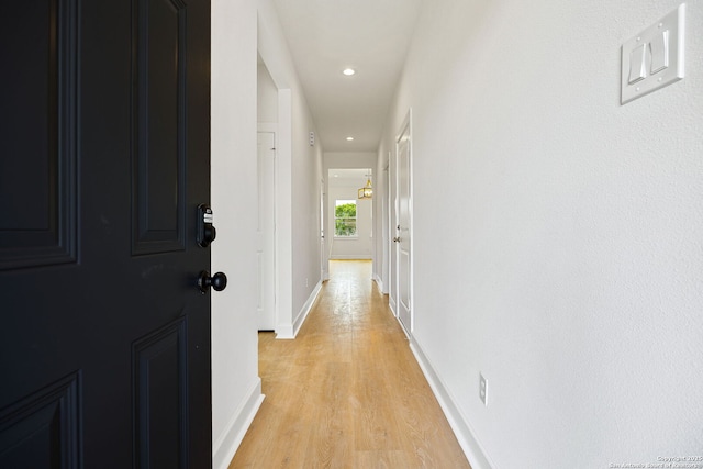 25 Main, Hempstead, TX 77445 - hallway with baseboards, recessed lighting, and light wood-style flooring