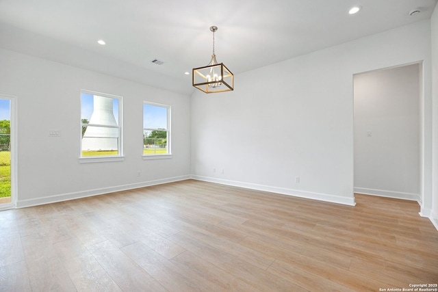 25 Main, Hempstead, TX 77445 - empty room featuring baseboards, recessed lighting, and a notable chandelier
