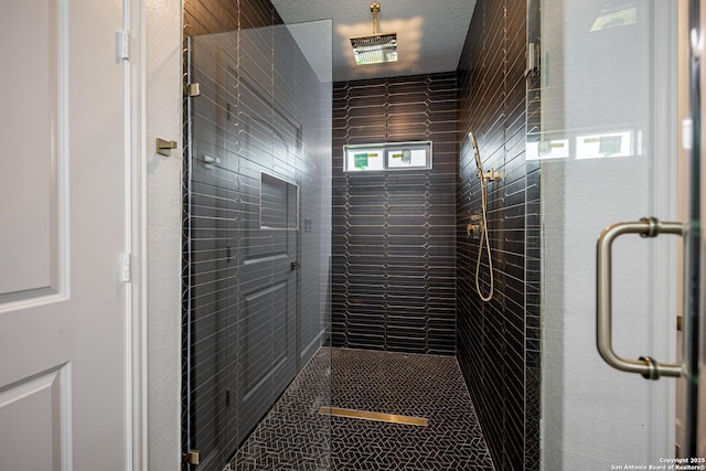 full bath featuring tile patterned floors and a stall shower
