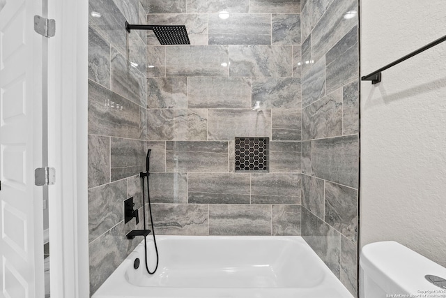 full bathroom with toilet and shower / washtub combination