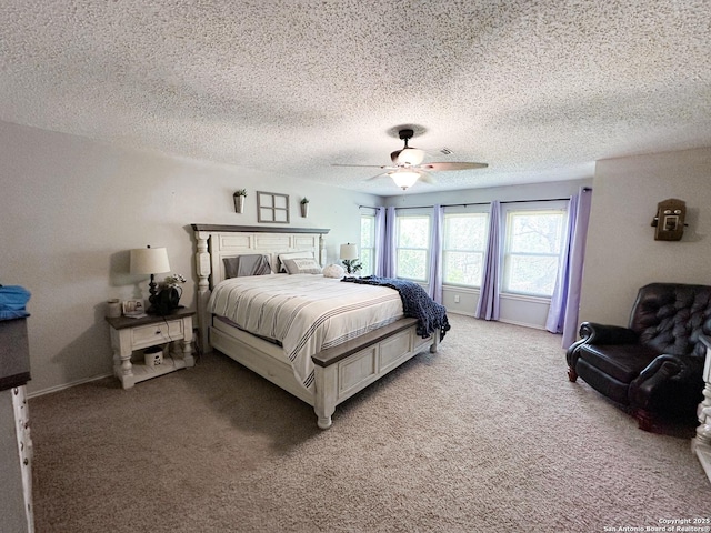 bedroom featuring light carpet, a ceiling fan, and a textured ceiling