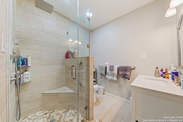 16002 Hickory Well Dr, San Antonio, TX 78247 - full bath with toilet, a stall shower, vanity, and baseboards