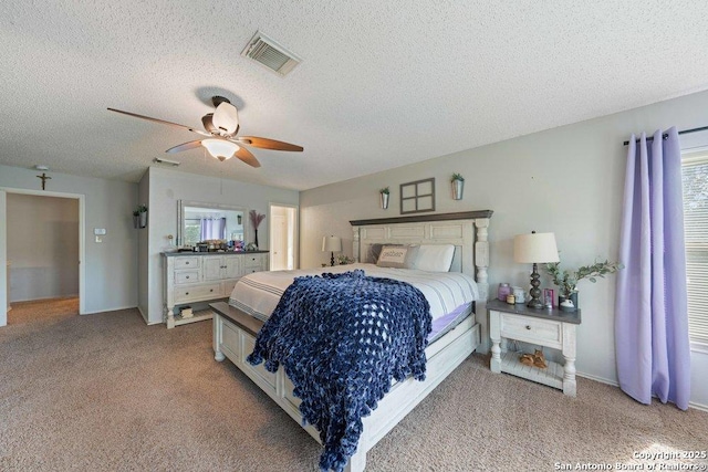 16002 Hickory Well Dr, San Antonio, TX 78247 - bedroom with a textured ceiling, light carpet, multiple windows, and a ceiling fan