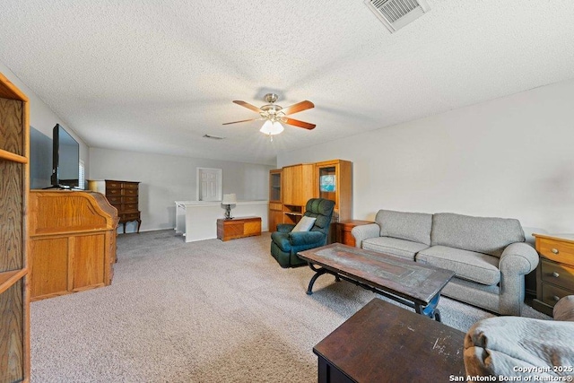16002 Hickory Well Dr, San Antonio, TX 78247 - carpeted living area with a ceiling fan and a textured ceiling