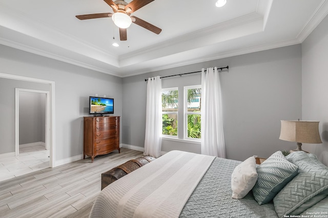 7186 Lake Placid, Corpus Christi, TX 78414 - bedroom with baseboards, ornamental molding, a raised ceiling, and wood tiled floor
