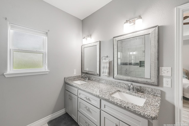 7186 Lake Placid, Corpus Christi, TX 78414 - bathroom featuring a sink, baseboards, a shower stall, and double vanity