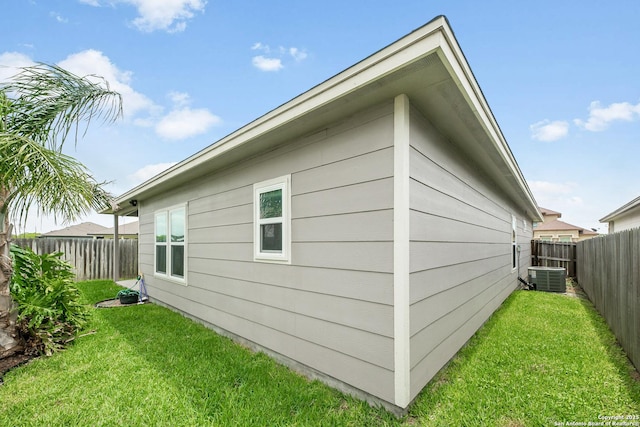 7186 Lake Placid, Corpus Christi, TX 78414 - view of property exterior featuring a lawn, central AC unit, and a fenced backyard