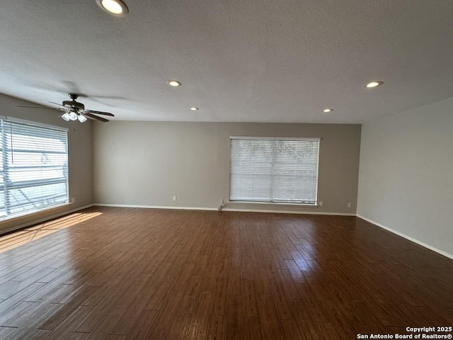 3624 Richwood, San Antonio, TX 78230 - empty room featuring baseboards, a ceiling fan, and dark wood-style flooring