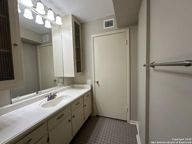 3624 Richwood, San Antonio, TX 78230 - bathroom with visible vents, baseboards, tile patterned floors, and vanity