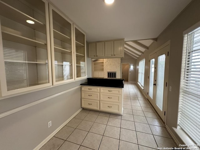 3624 Richwood, San Antonio, TX 78230 - kitchen featuring light tile patterned floors, vaulted ceiling with beams, a peninsula, and a healthy amount of sunlight