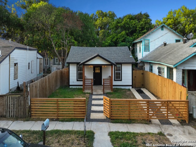 1851 Dawson St, San Antonio, TX 78202 - bungalow featuring roof with shingles, a gate, and a fenced front yard