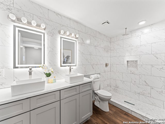 1851 Dawson St, San Antonio, TX 78202 - full bath with tiled shower, tile walls, and a sink