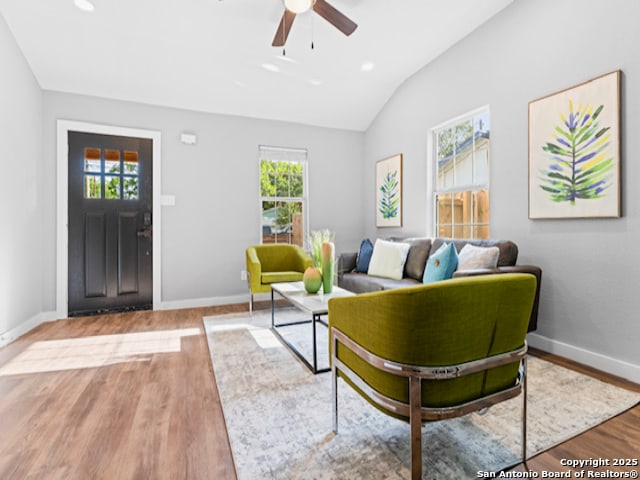 1851 Dawson St, San Antonio, TX 78202 - living area featuring ceiling fan, vaulted ceiling, a healthy amount of sunlight, and wood finished floors