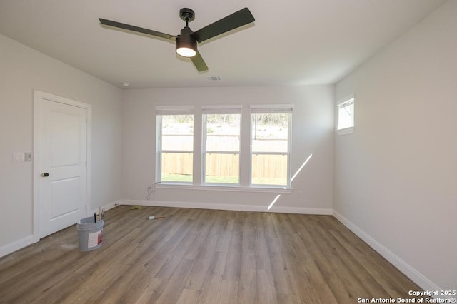 2707 Wild Skies, San Antonio, TX 78245 - unfurnished room featuring baseboards, ceiling fan, wood finished floors, and visible vents