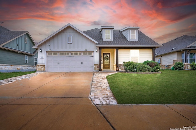 9154 Curling Post, Schertz, TX 78154 - view of front of house with an attached garage, a shingled roof, board and batten siding, concrete driveway, and a lawn
