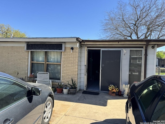 view of front of home with brick siding