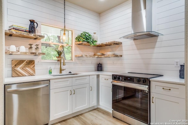kitchen featuring stainless steel dishwasher, electric range, open shelves, and wall chimney exhaust hood