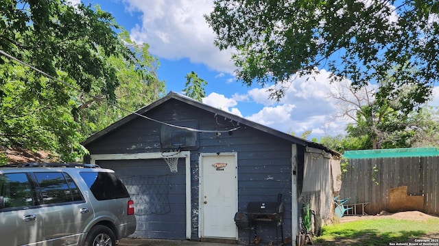 608 Harlan, San Antonio, TX 78214 - view of front of home featuring fence, a garage, and an outbuilding