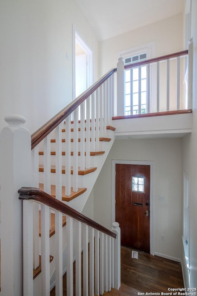 entryway with stairs and wood finished floors