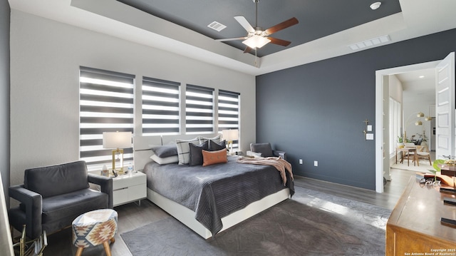 29919 Capstone Walk, Boerne, TX 78015 - bedroom with a ceiling fan, visible vents, wood finished floors, and a raised ceiling