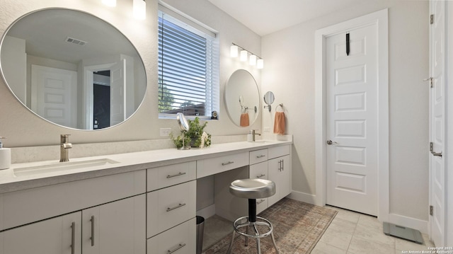 29919 Capstone Walk, Boerne, TX 78015 - bathroom featuring double vanity, visible vents, tile patterned flooring, a sink, and baseboards