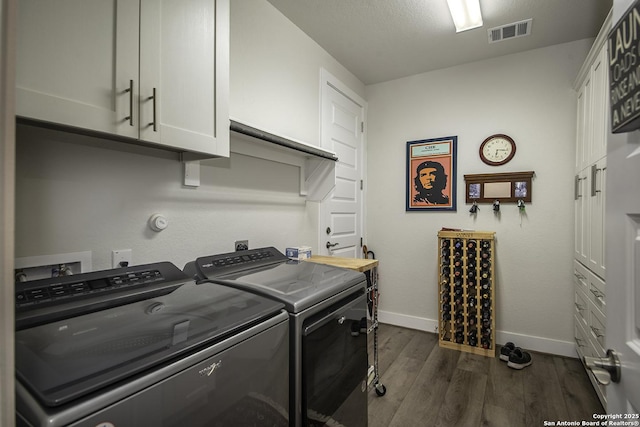 29919 Capstone Walk, Boerne, TX 78015 - laundry room featuring independent washer and dryer, dark wood-style flooring, cabinet space, baseboards, and visible vents