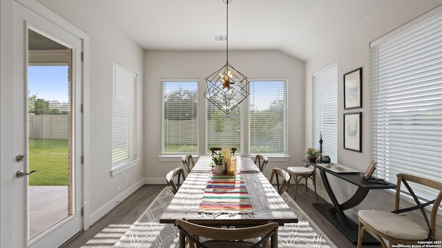29919 Capstone Walk, Boerne, TX 78015 - dining room featuring visible vents, vaulted ceiling, wood finished floors, baseboards, and an inviting chandelier