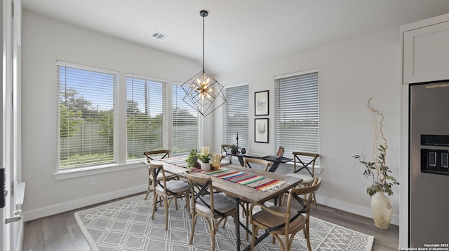 29919 Capstone Walk, Boerne, TX 78015 - dining room featuring baseboards, visible vents, an inviting chandelier, and light wood finished floors