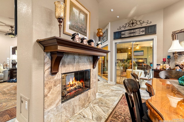 interior space with a tiled fireplace