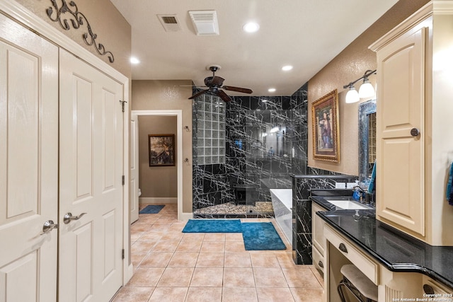 bathroom featuring ceiling fan, vanity, toilet, a shower stall, and visible vents
