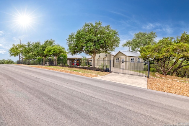 ranch-style home with a gate and a fenced front yard