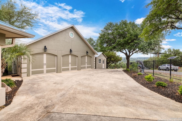 garage with fence