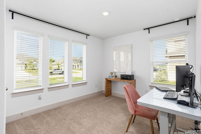 office space featuring baseboards and carpet