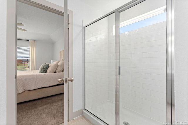 bathroom featuring a shower stall and ensuite bath